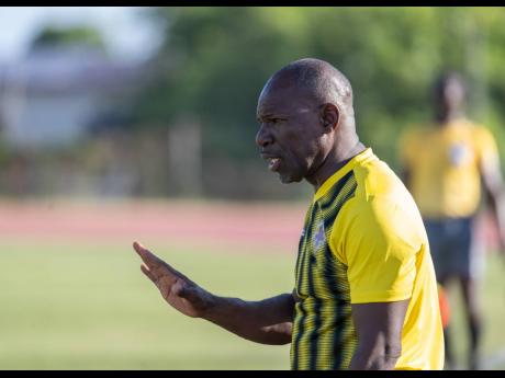 Credit: Gladstone Taylor Coach Vassel Reynolds gives instructions to his Humble Lion players during their 2-1 Jamaica Premier League loss to Cavalier at Stadium East on Wednesday.