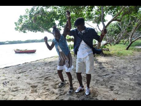 The elderly couple shows off dances moves while spending time on the beach in Prospect, St. Thomas.