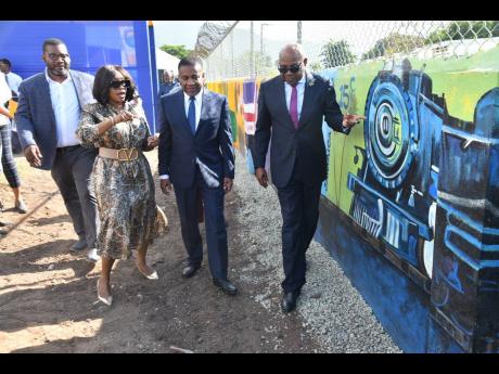 Tourism Minister Edmund Bartlett (right) is accompanied by (from left) Executive Director, Tourism Product Development Company Limited, Wade Mars; CEO, Bellevue Hospital, Camille Buchanan; and Member of Parliament for East Kingston and Port Royal, Phillip Paulwell, during a tour of the Eastern Kingston Promenade project on January 15 at 71 Windward Road in Kingston.