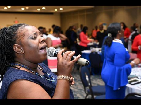 Sister Nicky sings at the Jamaica Constabulary Force New Year’s Prayer Breakfast at The Jamaica Pegasus hotel on Wednesday.