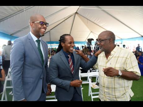 The three members of parliament whose constituencies lie within Portmore (from left) Robert Miller of St Catherine South Eastern; Alando Terrelonge of St Catherine East Central; and Fitz Jackson, of St Catherine Southern, share a moment at the park launch.