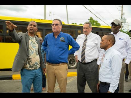 From left: Mayor of Kingston and St Andrew Delroy Williams, Transport Minister Daryl Vaz, Managing Director, Jamaica Urban Transit Company (JUTC), Paul Abrahams, JUTC General Manager, Keith Blake, and Transport Authority Chairman Owen Ellington tour downtown Kingston’s transportation hub on Thursday.