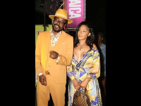 Beenie Man and fiancée Camille Lee (right) were decked out to enjoy the show,
