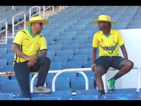 Former West Indies and Jamaica wicketkeeper/batsman Carlton Baugh Jr (left) chats with West Indies and Jamaica women’s cricketer Rashada Williams after a training session recently at Sabina Park.