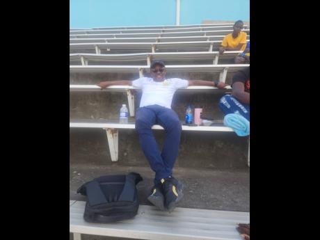 Credit: Raymond Graham Titchfield High’s principal, Richard Thompson, watches their athletes from the stands at last Saturday’s Queen’s Grace Jackson Invitational meet.