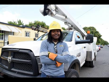 Tava Blake, female line worker at Jamaica Public Service.