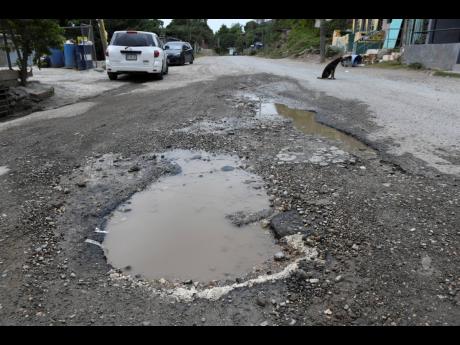 A massive pothole in roadway in Bull Bay, St Thomas.