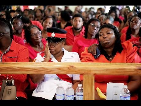 Credit: Contributed Mourners gather at the Giblatore Baptist Church in Bog Walk, St Catherine, last Saturday to pay their last respects to Constable Davan Cooper.