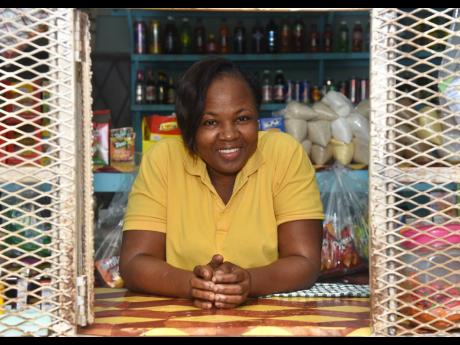 Credit: Ashley Anguin Charmaine Chambers is behind her shop counter at Barrett Hall in Lilliput, St James.