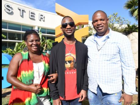 Credit: Ashley Anguin Photos Dancehall artiste Nigy Boy is flanked by aunt Margaret Hill and uncle Alvin Hill.