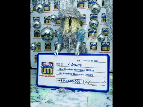 Credit: Contributed Super Lotto winner T. Rowe decked out in a Beyonce Renaissance-era inspired costume was in a celebratory mood at the official handover event for the her $144.6 million winnings.