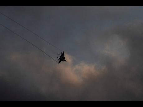 Credit: AP An Israeli Air Force F-15 jet fighter manoeuvres over northern Israel on the border with Lebanon.