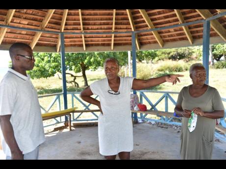 From left:  Hudson Parker, Sylvia Parker and Dawn Campbell expressing their dissapointment in the current state of the Lyssons Beach in St Thomas.