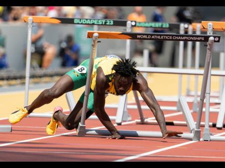 Jamaica’s Rasheed Broadbell falls while competing in the men’s 110 metres hurdles at the World Athletics Championships at the National Athletics Centre in Budapest, Hungary, last year.