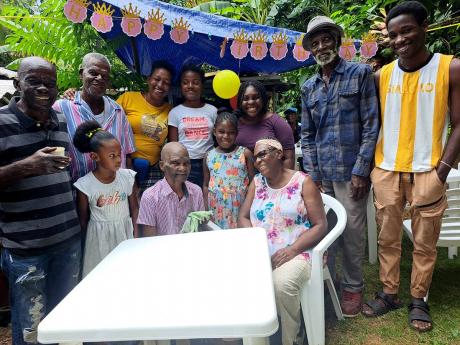 Thomas Higgins (centre, seated) is surrounded by family as he celebrated his 101st birthday.