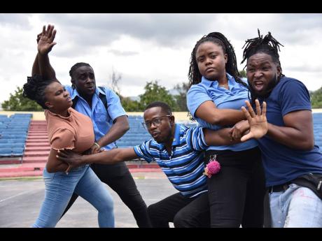 Credit: Antoine Lodge Members of the Pantomime Company perform Skoolaz 3.0 at the Peace Day concert held at the Ranny Williams Entertainment Centre in St Andrew on Tuesday.
