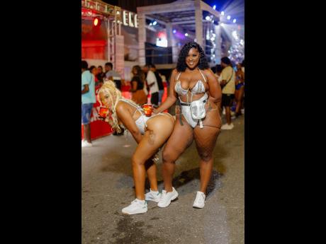 Patrons Sherana Robinson (left) and Sashana Graham at the Campari-sponsored Night Carnival event, held last Saturday at Ocean Boulevard in downtown Kingston.