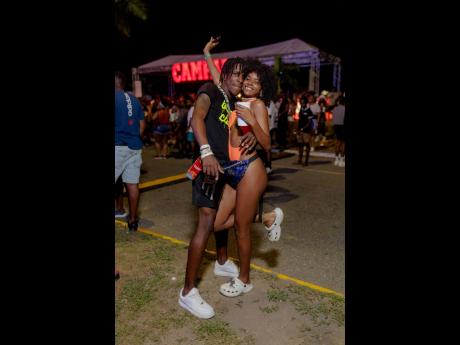 Credit: Contributed Patrons Christopher Graham (left) and Shamonique Williams were in downtown Kingston on Saturday night when the streets came alive with the vibrant rhythms of Night Carnival.