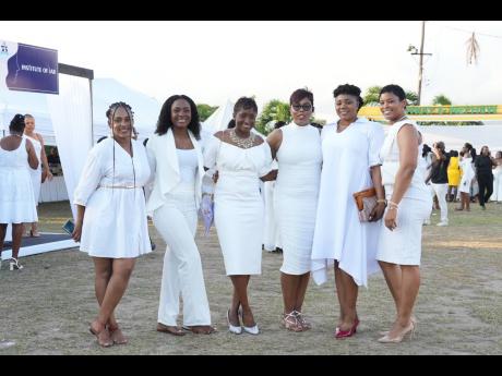 Members of the Jamaica Constabulary Force celebrate at the ‘PowHer Up’ marketplace and cocktail event, held at the Police Officers’ Club in St Andrew last Friday.