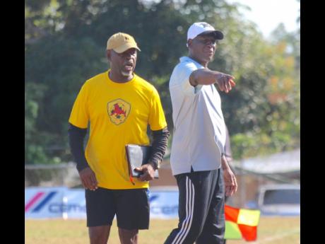 Humble Lion’s new coach Christopher Bender (right) gestures to his players while his assistant Linval Wilson shouts orders during their Jamaica Premier League encounter against Vere United at Effortville yesterday. Humble Lion won 3-0.