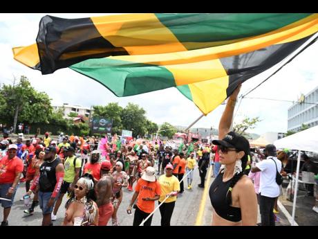 Revellers in the Yard Mas band on the road last year.