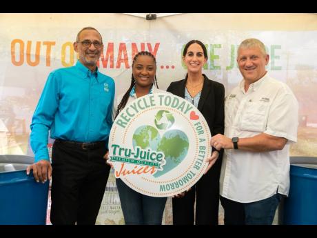 From left: Dr Damien King, chairman, Recycling Partners of Jamaica (RPJ); Candice Ming, marketing manager, RPJ; Lauren Mahfood, marketing manager, Tru-Juice; and Peter McConnell, managing director, Trade Winds Citrus, promote the importance of recycling during the handover ceremony of 600 drums to RPJ from Tru-Juice for recycling across 120 schools. 