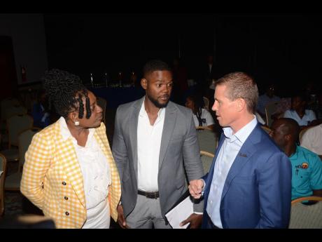 Mayor of Montego Bay, Richard Vernon (centre), interacts with Chairman of the Jill Stewart MoBay City Run, Janet Silvera (left), and Executive Chairman of Sandals Resorts International, Adam Stewart, during the launch of the 2024 staging of the event at the Holiday Inn in Rose Hall, St James, recently.