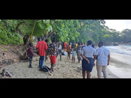 Haitians who came to Boston Beach in Portland last year en route to the Port Antonio Health Centre to undergo screening.