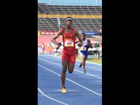 Credit: Ian Allen Mario Ross of Wolmer’s Boys’ School wins his Class Three 100 metres heat in 11.36 seconds on yesterday’s opening day of the 2024 ISSA/GraceKennedy Boys and Girls’ Athletics Championships at the National Stadium.