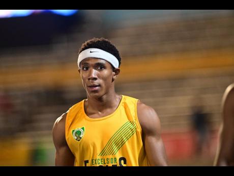 Excelsior High's Damor Miller wins his Class One boys' 100 metres semi-final at the ISSA/GraceKennedy Boys and Girls' Athletics Championships at the National Stadium today.