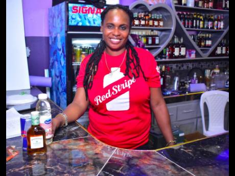 Lisa Consignment draws customers to the bar with her bright smile.