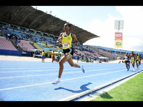 Alphansus Davis High's Alikay Reynolds has a considerable lead on her rivals in the Class Three girls' 800 metres today at the ISSA/GraceKennedy Boys and GIrls' Athletics Championships at the National Stadium. Reynolds won semi-final two in 2:16.51 minutes.