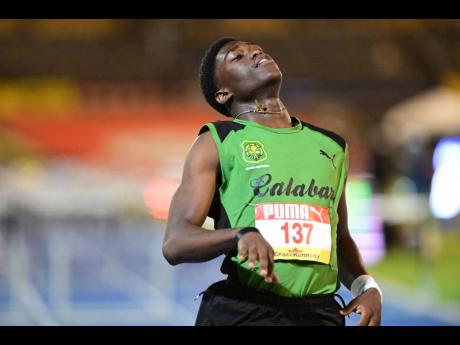 Credit: Gladstone Taylor Calabar High's Michael Dwyer relaxes after winning semi-final three of the Class Two boys' 110 metres hurdles at the ISSA/GraceKennedy Boys and Girls' Athletics Championships at the National Stadium today. Miller clocked 14.05 seconds.