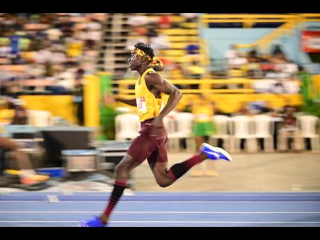 Credit: Gladstone Taylor Muschett High’s Johan-Ramaldo Smythe comfortably wins the Class Two boys' 200 metres semi-final two in 21.31 seconds at the ISSA/GraceKennedy Boys and Girls' Athletics Championships at the National Stadium tonight.