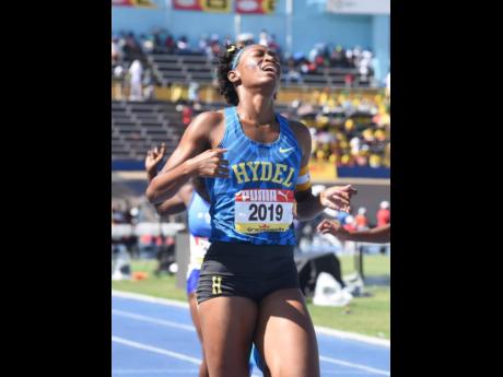 Hydel HIgh's Alliah Baker gets emotional after winning the Class One girls' 200 metres final in 22.89 seconds at the ISSA/GraceKennedy Boys and GIrls' Athletics Championships at the National Stadium today.