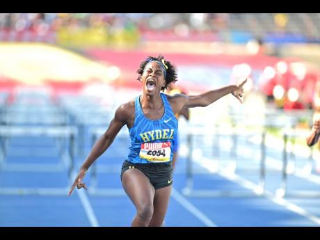 Hydel High's Shannia Myers shouts for joy after winning the Class One girls' 100 metres hurdles final in 13.14 seconds at the ISSA/GraceKennedy Boys and Girls' Athletics Championships at the National Stadium today.