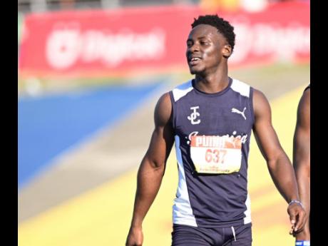 Jamaica College’s Daniel Beckford smiles approvingly after winning the Class One boys' 110 metres hurdles at the ISSA/GraceKennedy Boys and Girls' Athletics Championships at the National Stadium today. Beckford clocked 13.45 seconds.
