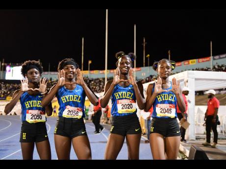 Hydel High's Class Four girls' 4x100 metres relay members celebrate their victory at the ISSA/GraceKennedy Boys and Girls' Athletics Championships at the National Stadium tonight.