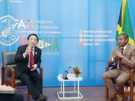 Agriculture Minister Floyd Green (right) meets with QU Dongyu, Director-General of the Food and Agriculture Organization of the United Nations (FAO) on March 20, at the 38th Regional Conference of FAO for Latin America and the Caribbean. 