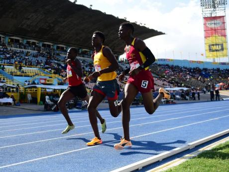 Maggotty High’s Yoshane Bowen (right) paces with rivals before moving away to win Class One boys’ 800 metres semi-final two at the ISSA/GraceKennedy Boys and Girls’ Athletics Championships today at the National Stadium. Bowen’s time of 1:57.88 minutes was the fastest from the semi-finals.