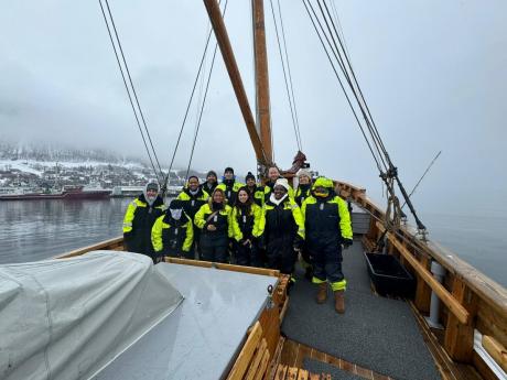 The crew and guests take a pic on board the fishing vessel.