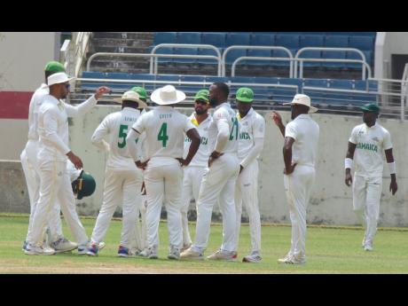 Jamaica Scorpions’ players celebrate a wicket against Guyana Harpy Eagles on yesterday’s first day of their West Indies Championship match at Sabina Park.