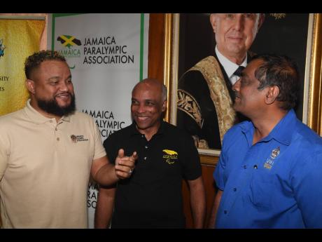 Credit: Gladstone Taylor/Multimedia Photo Editor From left: Jamaica Olympic Association Secretary/General, CEO Ryan Foster, President Christopher Samuda and University of the West Indies Faculty of Sports’ Dr Akshai Mansing dialogue at the press conference to announce the Gather, Adjust, Prepare, Sustain (GAPS) Americas and Caribbean Programme at The University of the West Indies on Thursday.