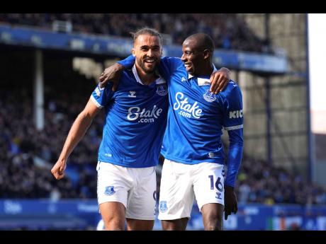 Everton’s Dominic Calvert-Lewin (left) celebrates scoring the only goal of the match with teammate Abdoulaye Doucoure during the English Premier League football match against Burnley at Goodison Park in Liverpool, England, recently.