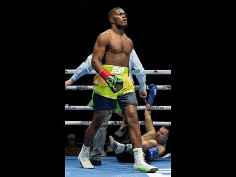 Jamaica’s Jerone ‘Beast’ Ennis walks to his corner after putting Argentinian Marcelo Adrian Fernandez on the canvas during their four-round  light-heavyweight fight at the Pickering Casino Resort in Ontario, Canada, last Saturday.