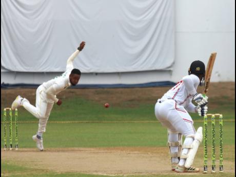 Jamaica Scorpions debutant Andre McCarthy (left) bowls to Trinidad and Tobago Red Force opener Cephas Cooper during the opening day of their West Indies Championship final-round match at Sabina Park yesterday. 
