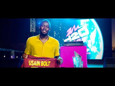 Jamaican sprint icon Usain Bolt holds a jersey bearing his name yesterday after being presented as an ambassador for the ICC Twenty20 World Cup, which will be held in the Caribbean and the United States of America.