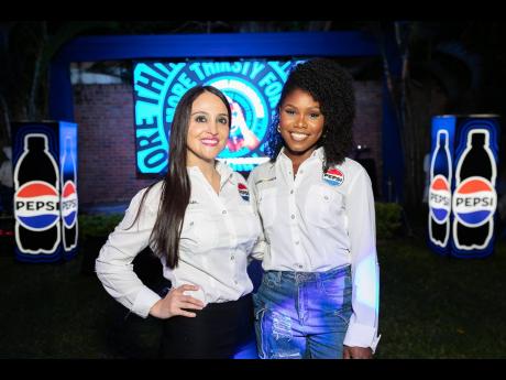 Magnolia Vanegas (left), field marketing manager, shares a pic with Karonna Atkins, brand coordinator for Pepsi-Cola Jamaica.