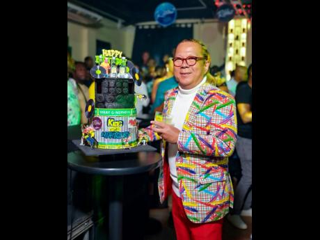 Ribbi shows off the Wray & Nephew White Rum-inspired cake.