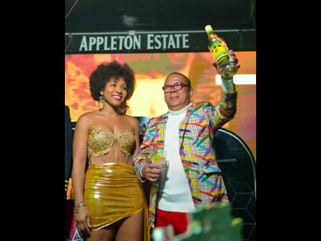 Attorney-at-Law Roshania Howard and Brian ‘Ribbi’ Chung share a toast with the gathering.